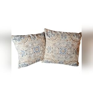 Set of two artistic accent pillows.